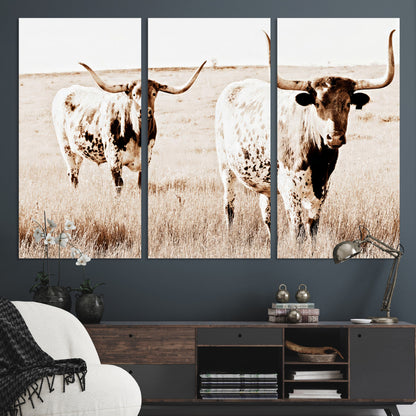 Two Texas longhorn cows standing in a sepia-toned pasture, evoking rustic charm perfect for farmhouse or western country interiors. (