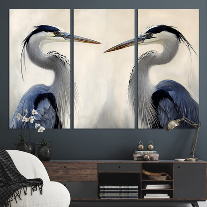 Two blue herons facing each other on a soft neutral background, ideal for coastal, tranquil, or nature-inspired minimalist interiors.