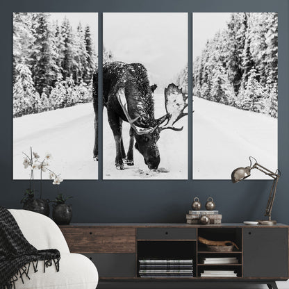 A majestic moose grazing in the snow-covered wilderness, surrounded by snow-covered trees, creating a peaceful winter scene.