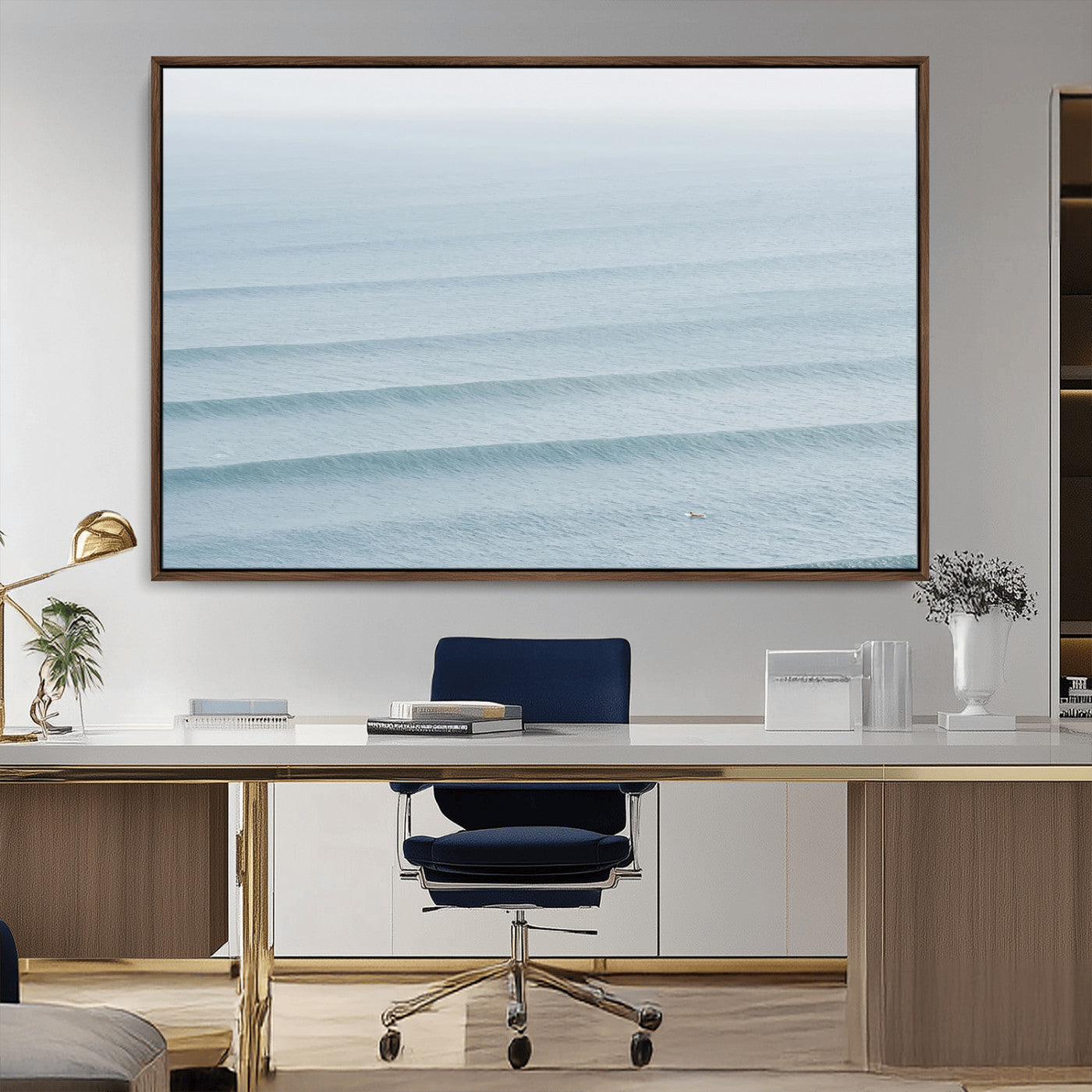 Framed canvas of repeating ocean waves with a distant solo surfer, ideal for minimalist ocean or calm coastal wall decor.