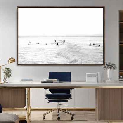Monochrome photo of surfers riding and waiting on ocean waves, ideal for surf-themed or coastal energy wall decor.