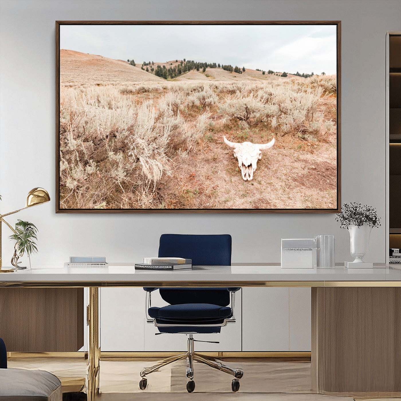 Rustic bull skull on dry sagebrush field under soft light, ideal for western minimal or desert prairie-style wall decoration.