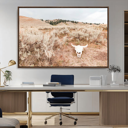 Rustic bull skull on dry sagebrush field under soft light, ideal for western minimal or desert prairie-style wall decoration.