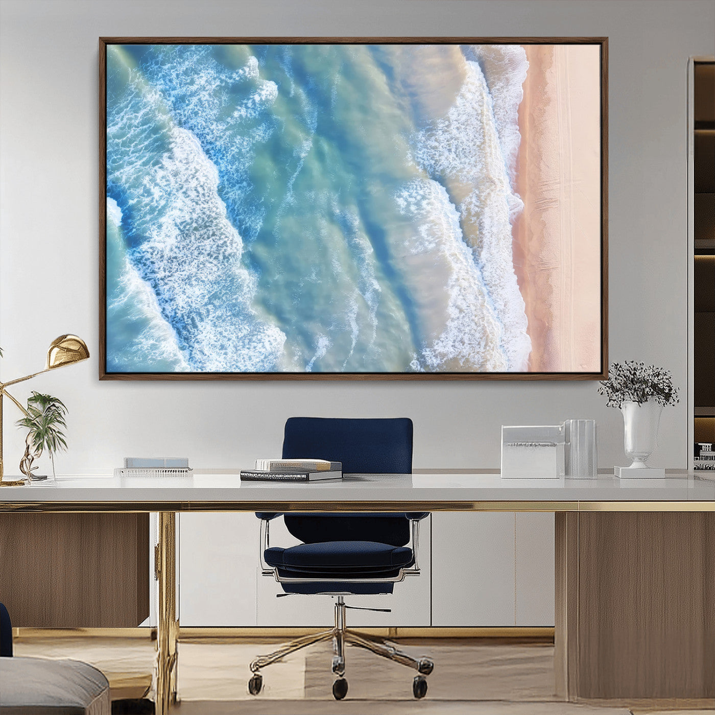 Aerial photo of soft blue waves meeting sandy shore, perfect for modern coastal or beach-themed decor with a light and tranquil aesthetic.