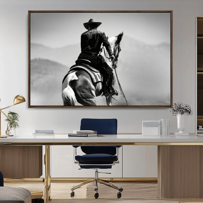 Black and white canvas of a cowboy on horseback with moody tones, perfect for rustic western or country-inspired home decor.