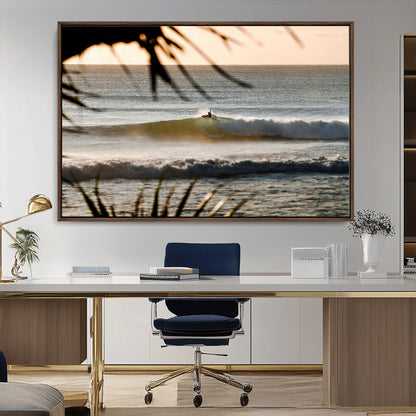 Photo of a surfer riding a golden hour wave at sunset, with tropical tones and dreamy light, perfect for tropical boho or coastal home decor.