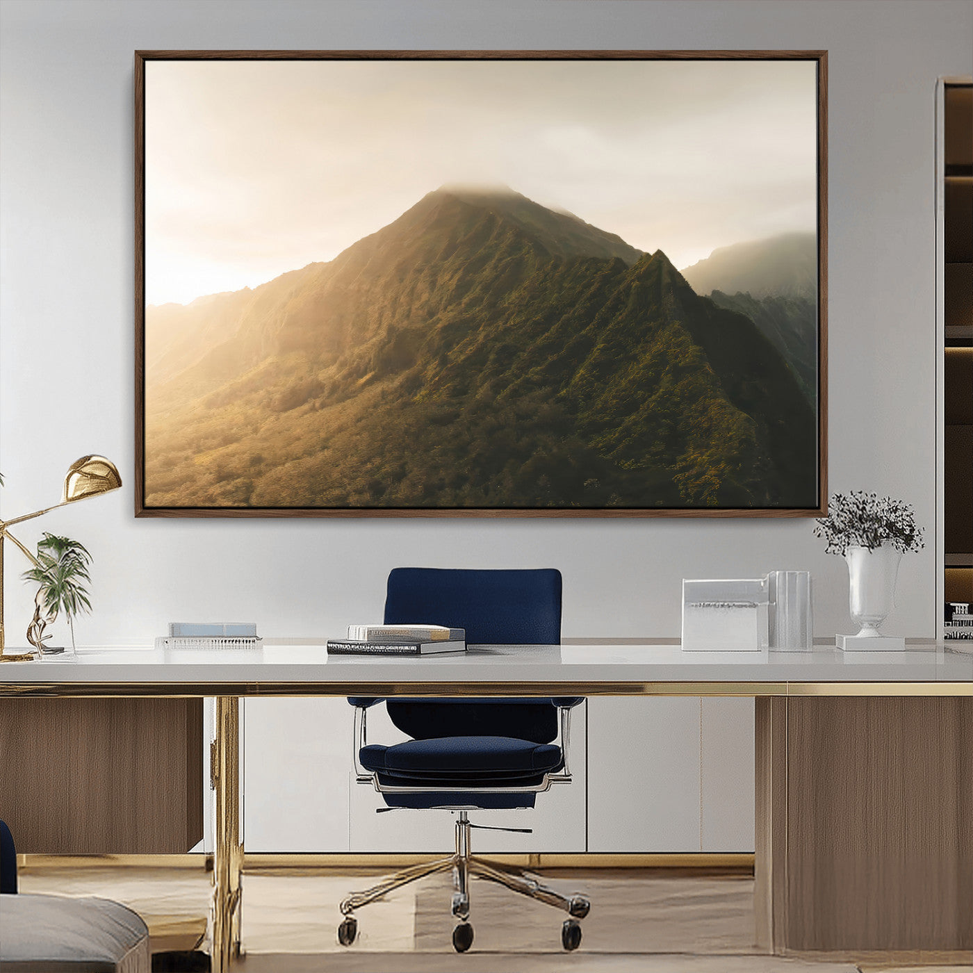 Sunlit mountain peak with mist rolling over its rugged slopes, bathed in golden light, creating a warm and tranquil nature-inspired scene.