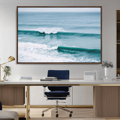 Powerful ocean waves rolling towards the shore, their turquoise hues blending with white sea foam under an open horizon, capturing the essence of the ocean's movement.