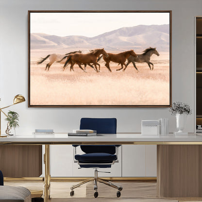 A herd of wild horses galloping through a sunlit desert plain with mountains in the background, perfect for rustic or western-themed wall decor.