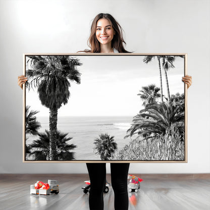 Monochrome canvas of palm trees framing a coastal surf scene, perfect for California-inspired or retro black-and-white beach decor.