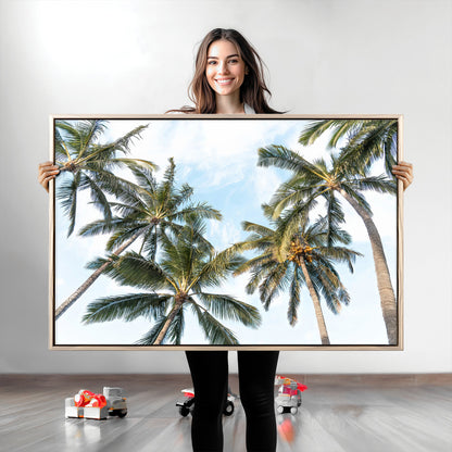 Framed canvas of tall palm trees reaching into a tropical sky, ideal for beach home or relaxed island-inspired wall decor.