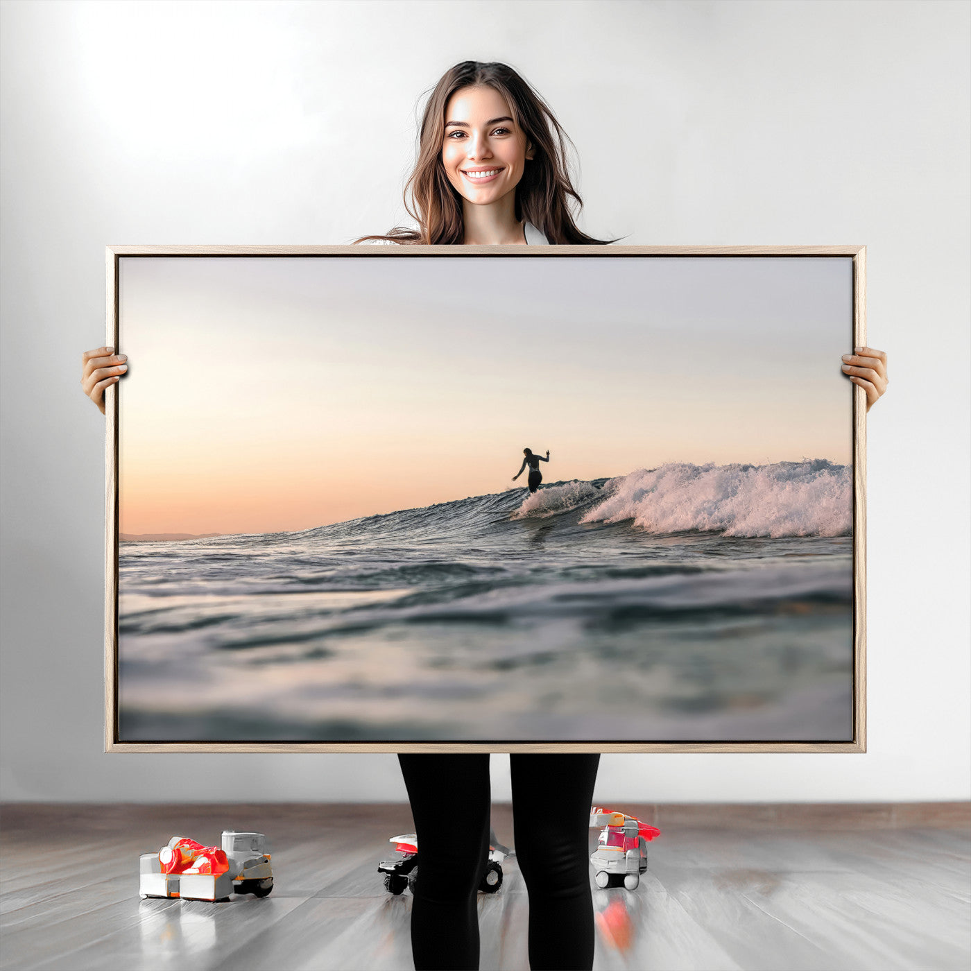 Framed canvas of a female surfer balancing on a wave at sunset, perfect for serene surf or ocean-inspired coastal decor.