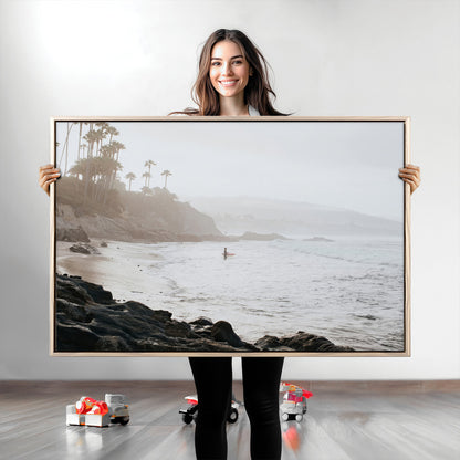 Framed canvas of a surfer in misty coastal tones at a foggy California beach, ideal for minimalist coastal beach or serene ocean-themed decor.