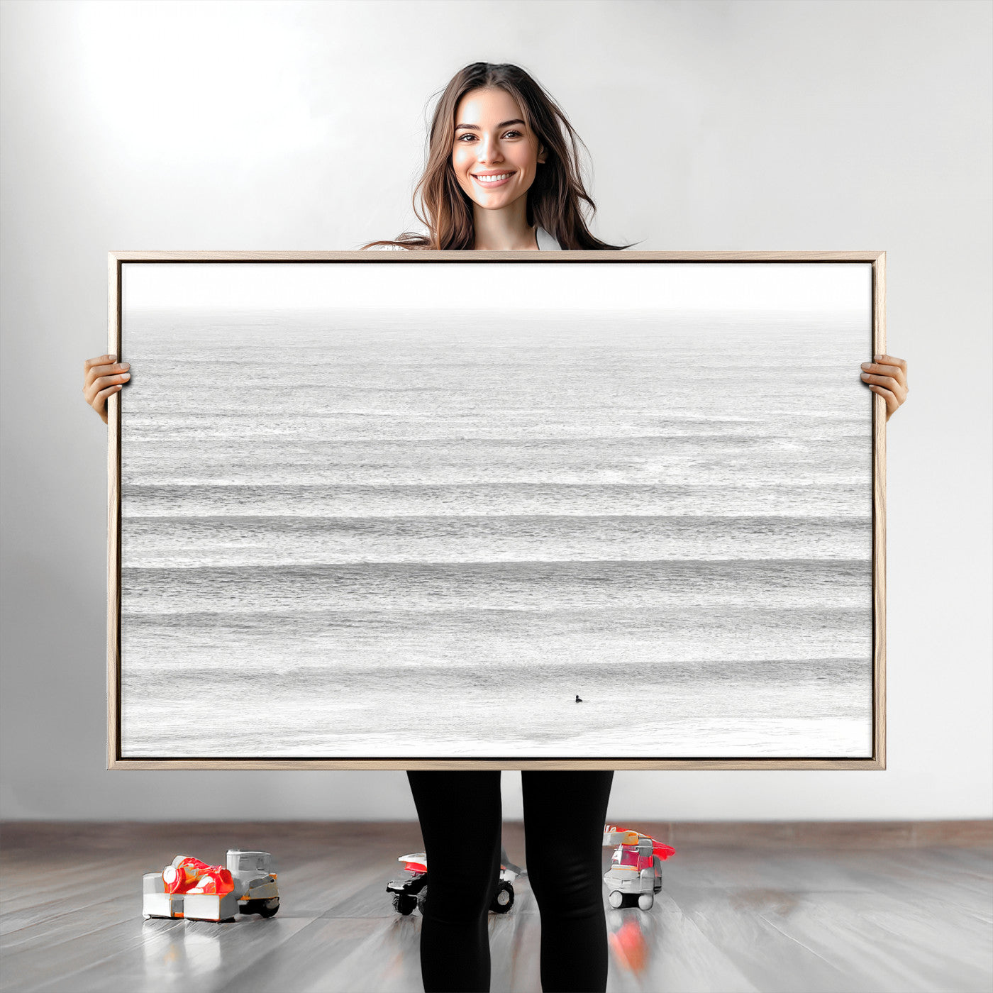 Monochrome photo of a lone surfer in calm layered waves, perfect for minimalist coastal or moody ocean-inspired wall decoration.