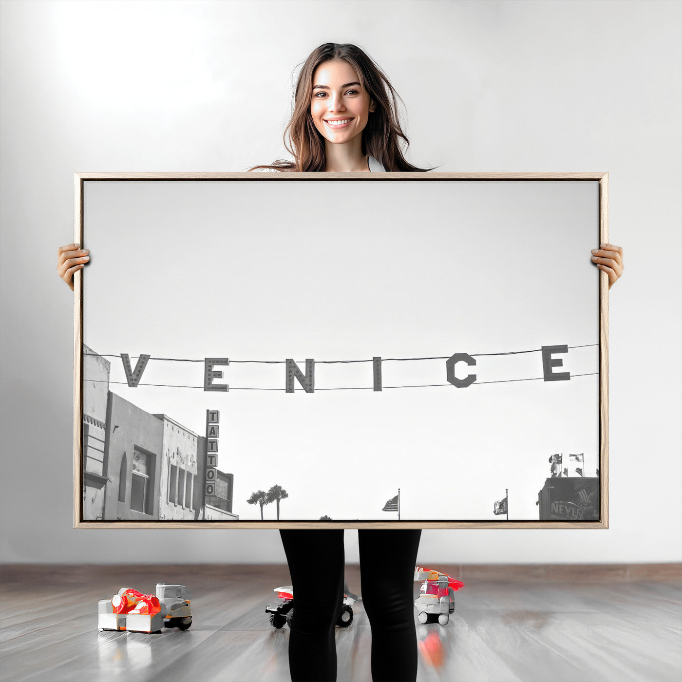 Black and white photo of Venice Beach sign and palm-lined street, perfect for urban coastal or minimalist LA-inspired wall decoration.