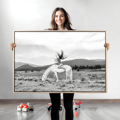 Black and white photo of a woman on a white horse in moody tones, ideal for Western Boho or modern rustic-style home decor.