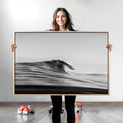 Striking black and white photo of a curling wave, ideal for modern coastal or minimalist wall decor settings.