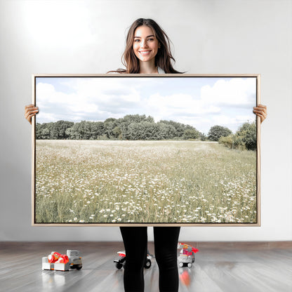 Soft-toned image of a wild daisy field under a cloudy sky, ideal for neutral or Scandinavian-inspired home decor.