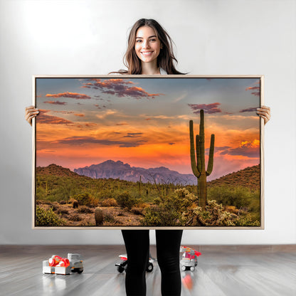 Vibrant desert sunset with saguaro cacti and distant mountains, perfect for Southwestern or warm-toned home decor.