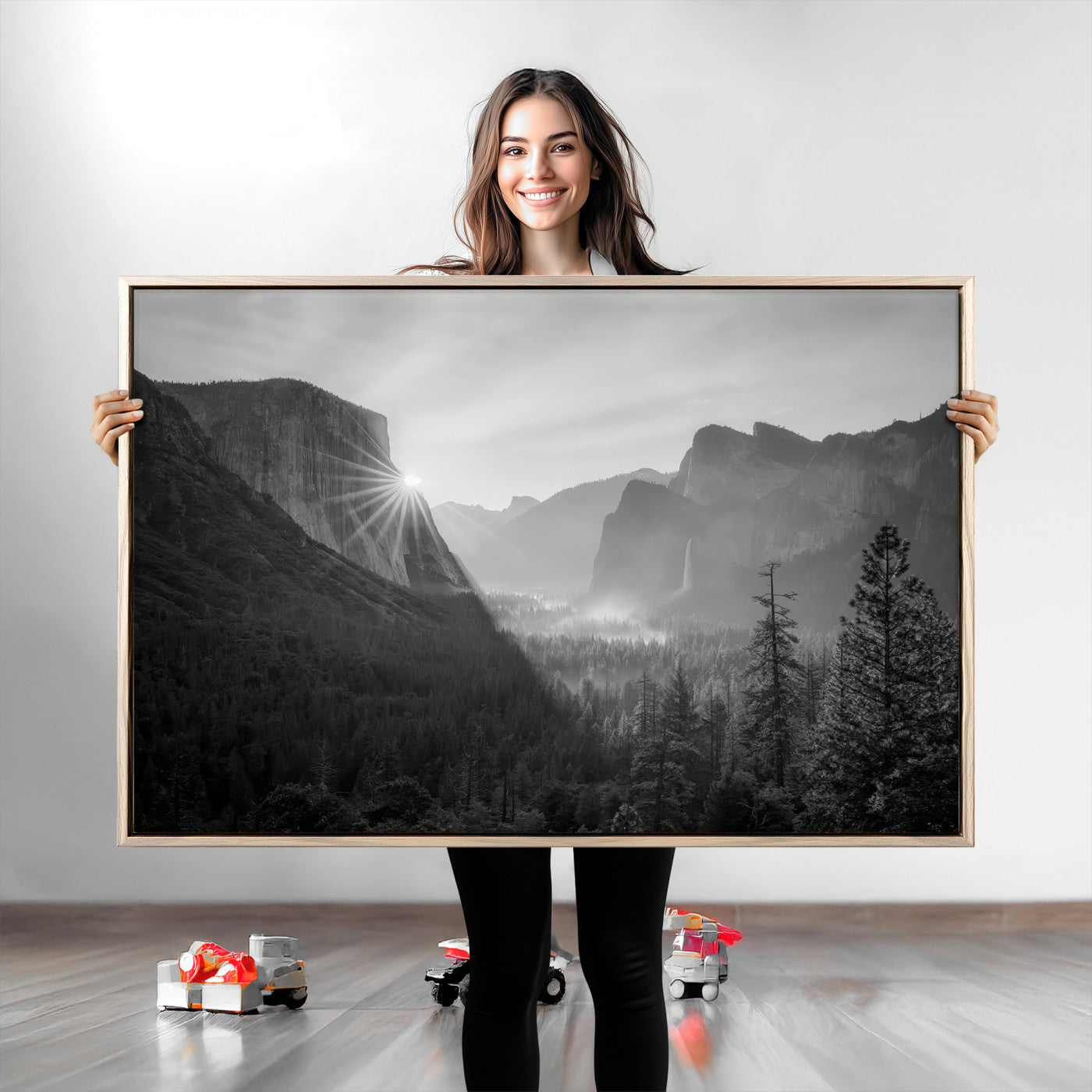 Black and white landscape of Yosemite with sun rays peeking over El Capitan, ideal for moody nature or modern rustic decor.