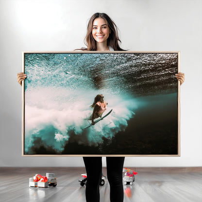Vibrant underwater photo of a female surfer diving through turquoise waves, perfect for coastal boho or surf-inspired home decor.