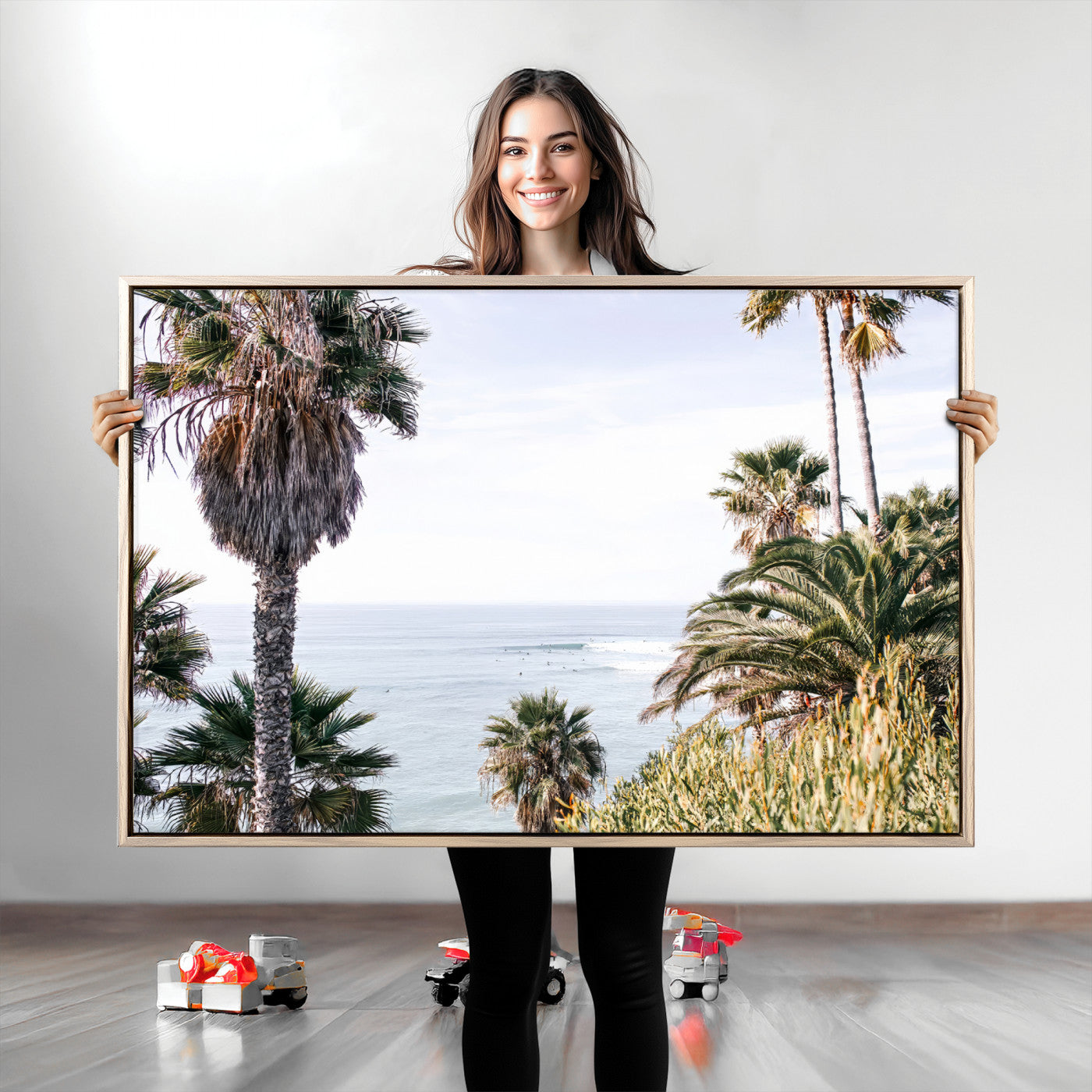 Scenic coastal view with tall palm trees overlooking a calm ocean, soft blue waves, and surfers in the distance, creating a peaceful tropical vibe.