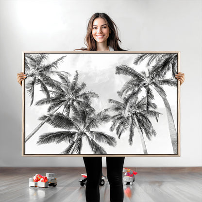Black and white tropical palm trees viewed from below, swaying gently against a bright sky, creating a serene and elegant coastal atmosphere.