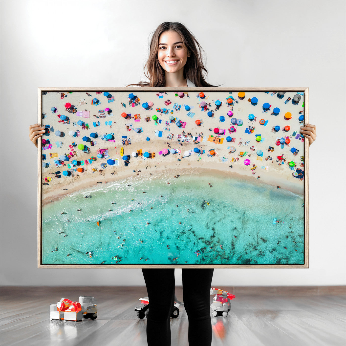 Aerial view of a vibrant beach filled with colorful umbrellas and people enjoying the turquoise ocean, capturing a lively summer vacation scene.