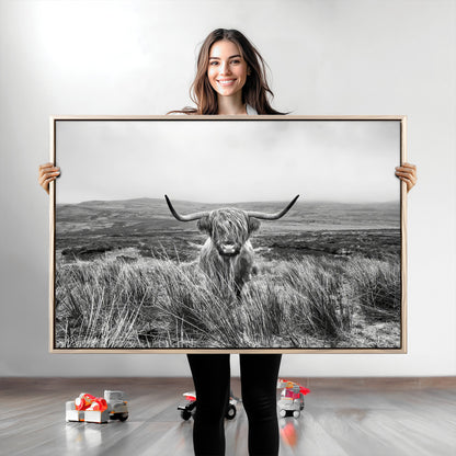 A black and white portrait of a Highland cow in a foggy Scottish countryside, capturing a rustic aesthetic and tranquil farm escape.