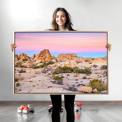 A breathtaking desert landscape featuring rugged rock formations under a vibrant pastel sunset sky, capturing the warmth and serenity of a Southwestern wilderness.