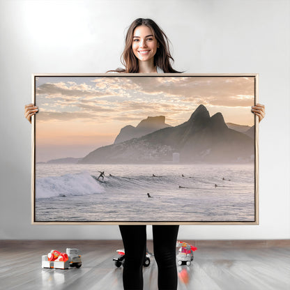 A surfer rides a golden hour wave near misty coastal mountains, surrounded by fellow surfers, capturing the spirit of a coastal adventure.