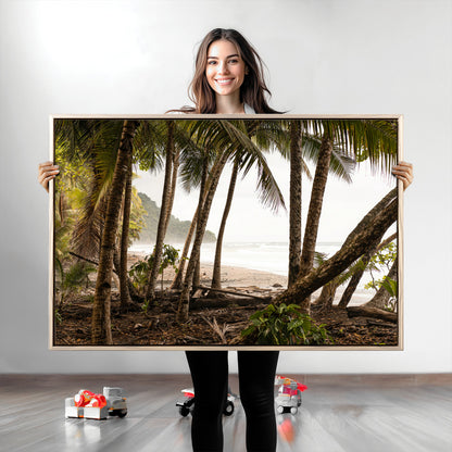 Dense tropical palm trees framing a sandy beach and ocean shore, ideal for jungle or coastal themed interior wall decor.