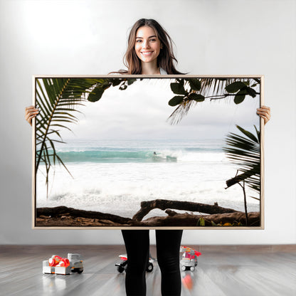 Tropical beach view with palm trees and surfer riding a wave, perfect for boho or coastal-inspired interior wall decor.