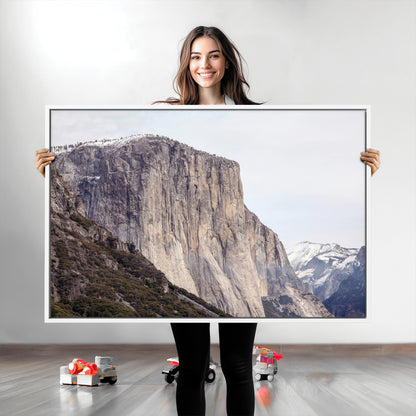 Framed canvas of El Capitan’s vertical granite face in Yosemite with snowy peaks, ideal for Sierra minimalism or mountain-inspired decor.