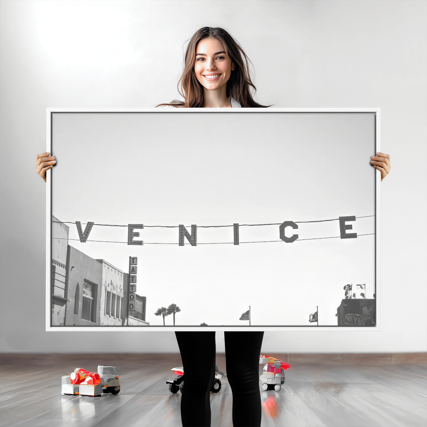 Black and white photo of Venice Beach sign and palm-lined street, perfect for urban coastal or minimalist LA-inspired wall decoration.