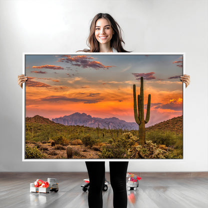 Vibrant desert sunset with saguaro cacti and distant mountains, perfect for Southwestern or warm-toned home decor.