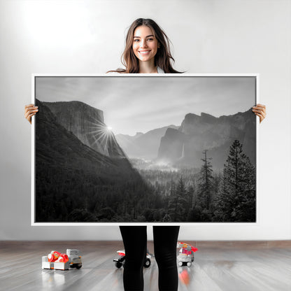 Black and white landscape of Yosemite with sun rays peeking over El Capitan, ideal for moody nature or modern rustic decor.