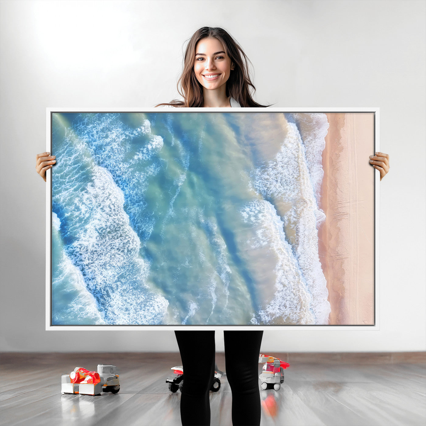 Aerial photo of soft blue waves meeting sandy shore, perfect for modern coastal or beach-themed decor with a light and tranquil aesthetic.