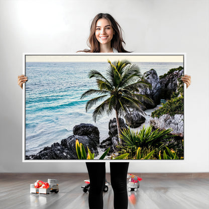Framed canvas of a vibrant tropical coastline with palm trees, rocky cliffs, and turquoise waters, ideal for tropical coastal home decor.