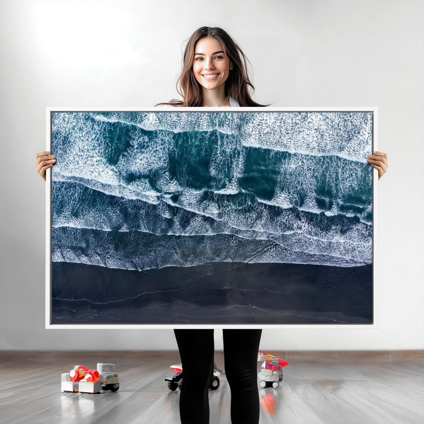 Canvas of aerial ocean waves crashing onto a black sand beach in moody tones, ideal for modern coastal or minimalist home decor.