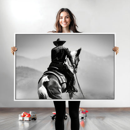 Black and white canvas of a cowboy on horseback with moody tones, perfect for rustic western or country-inspired home decor.