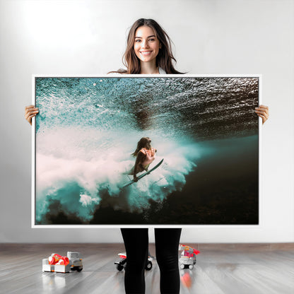 Vibrant underwater photo of a female surfer diving through turquoise waves, perfect for coastal boho or surf-inspired home decor.