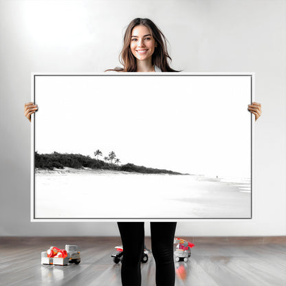 A black and white minimalist coastal scene with a vast open beach, distant palm trees, and a lone figure walking along the shoreline, evoking serenity and solitude.