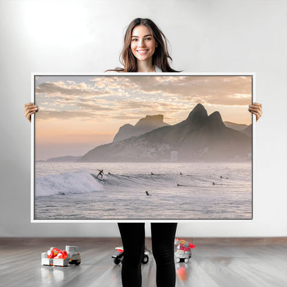 A surfer rides a golden hour wave near misty coastal mountains, surrounded by fellow surfers, capturing the spirit of a coastal adventure.