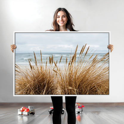 Canvas of golden beach grass swaying by the ocean under a soft cloudy sky, perfect for neutral-toned or coastal minimalist decor.