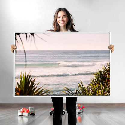 Canvas of a lone surfer riding a pastel wave at sunrise, perfect for tropical or coastal-themed spaces with a relaxed, airy vibe.