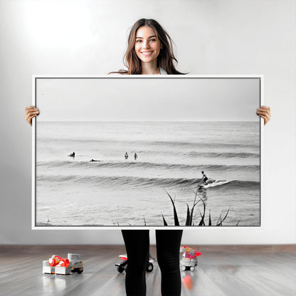 Monochrome canvas of surfers on calm ocean waves, ideal for minimalist coastal or beach-inspired interior decor.