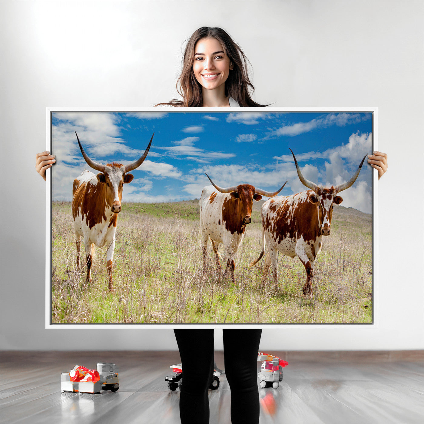 Three Texas longhorn cattle standing in dry grass under a bright blue sky, ideal for farmhouse or western rustic home decor.