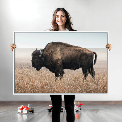 A lone bison stands in a vast prairie under a soft sky, evoking freedom and rustic charm for western or farmhouse inspired interiors.