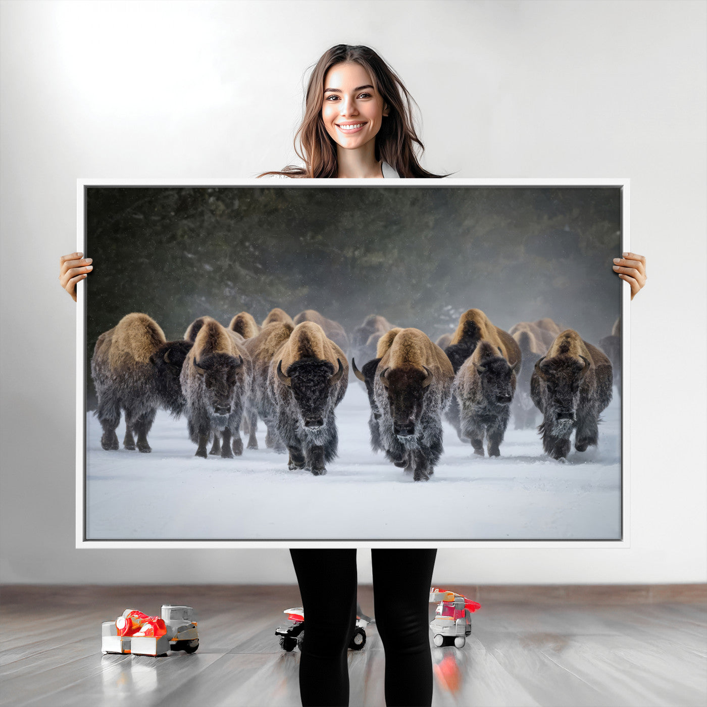 A herd of American bisons walking through deep snow in a forest, evoking a powerful rustic wilderness mood for western-style interiors.